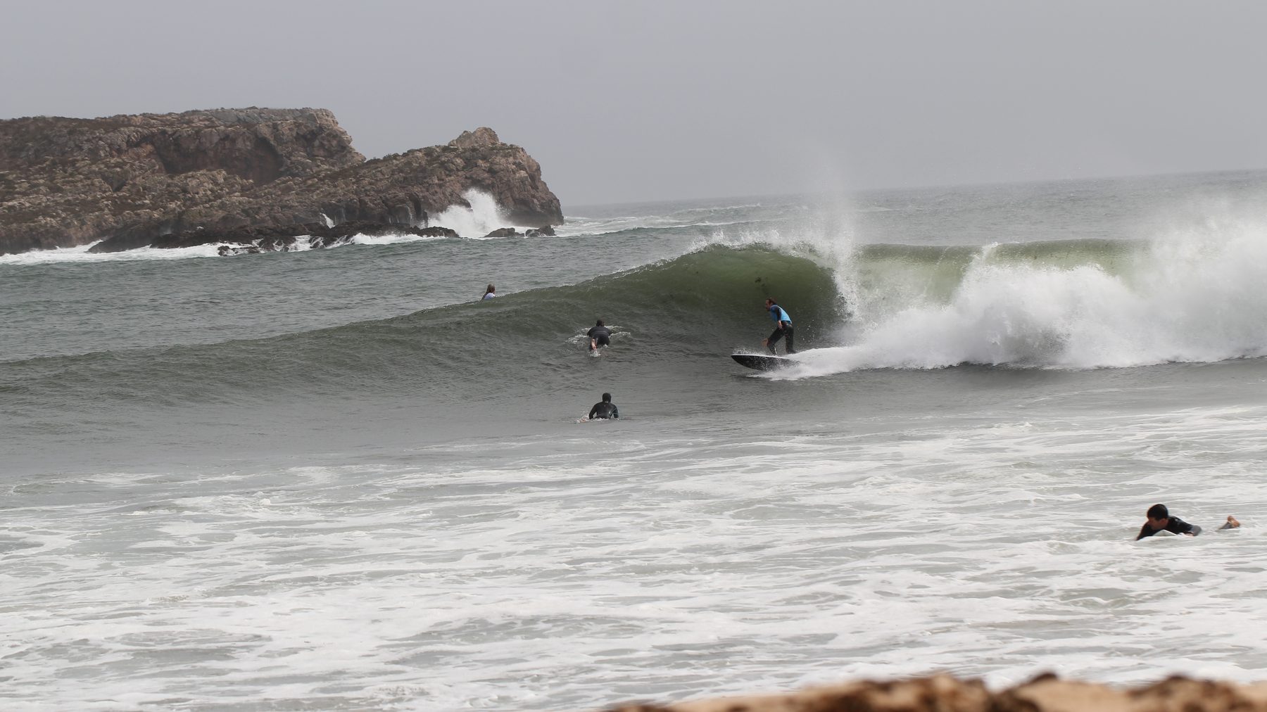 A surfer trimming along an open face on a clean morning